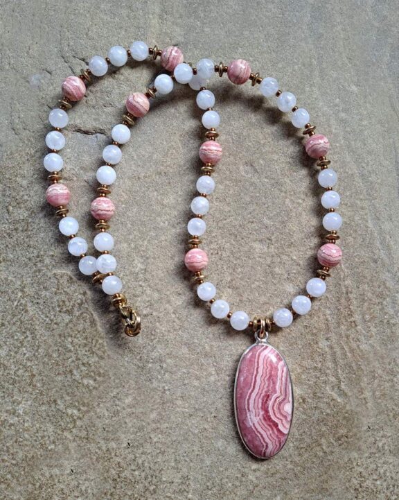 Rhodochrosite pendant on a crystal necklace - jewelry of healing stones