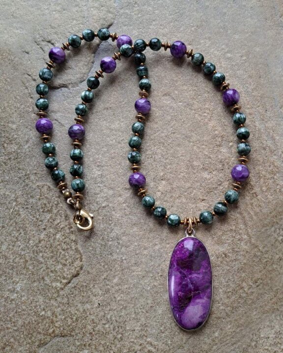 Sugilite pendant on a necklace made of crystal beads - fine ritual jewellery